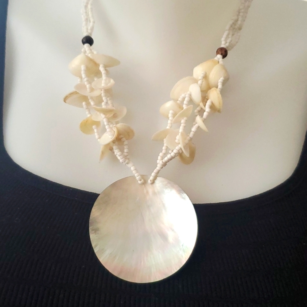 A beautiful Albolone shell necklace pendant. Can be worn 2 ways.